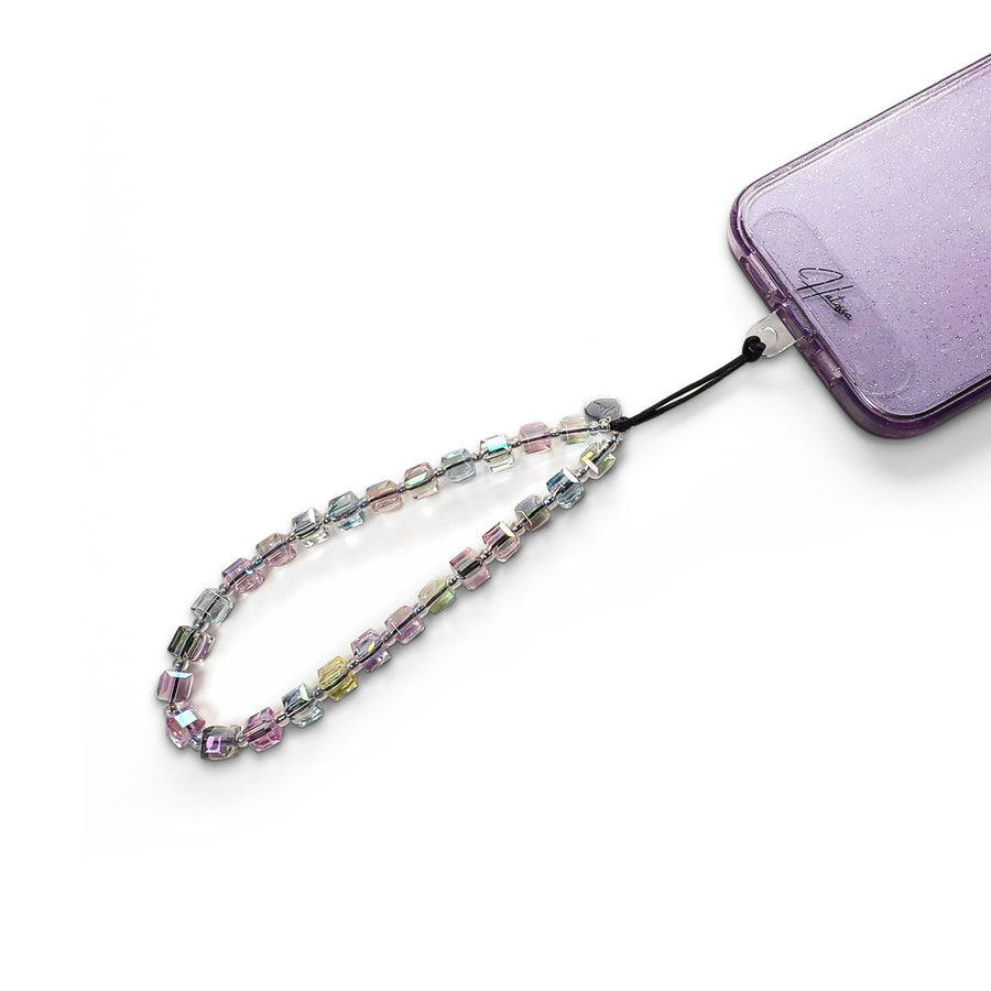 Aura Hatossa Phone Charm attached to a phone with a universal lanyard holder. 