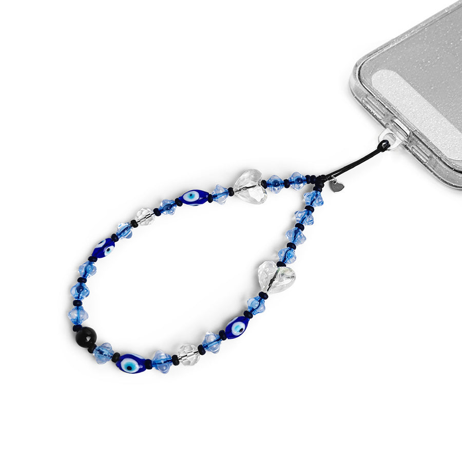 Caspian Hatossa Phone charm attached to a phone with a universal lanyard holder. 