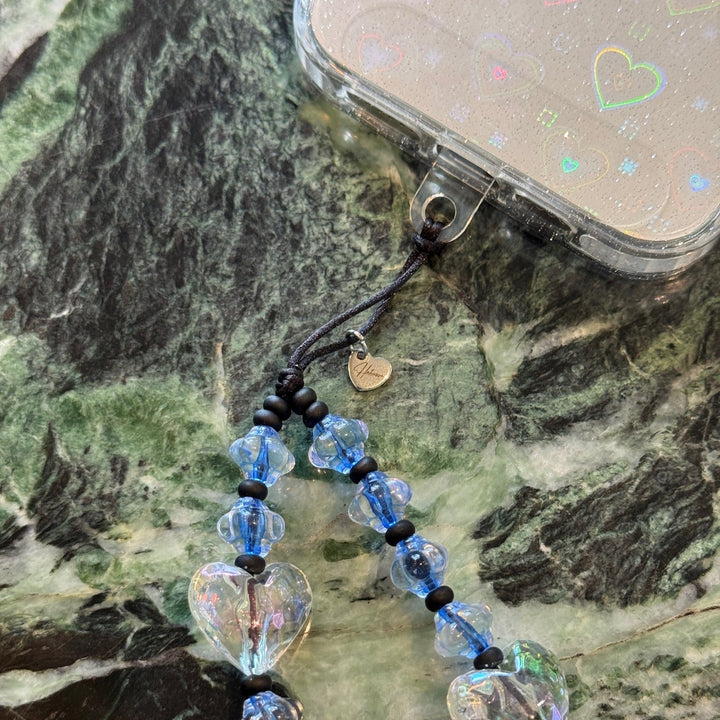 Image shows the Hatossa CASPIAN phone strap, phone charm, with the universal lanyard holder that can be used with any device, ebook, airpods