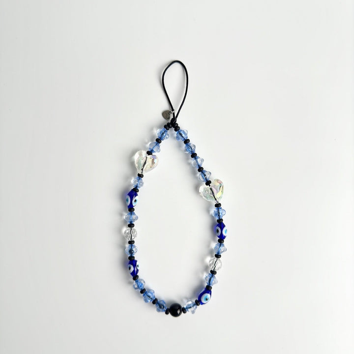 Image shows the Hatossa Caspian phone strap, phone charm, with the universal lanyard holder that can be used with any device, ebook, airpods