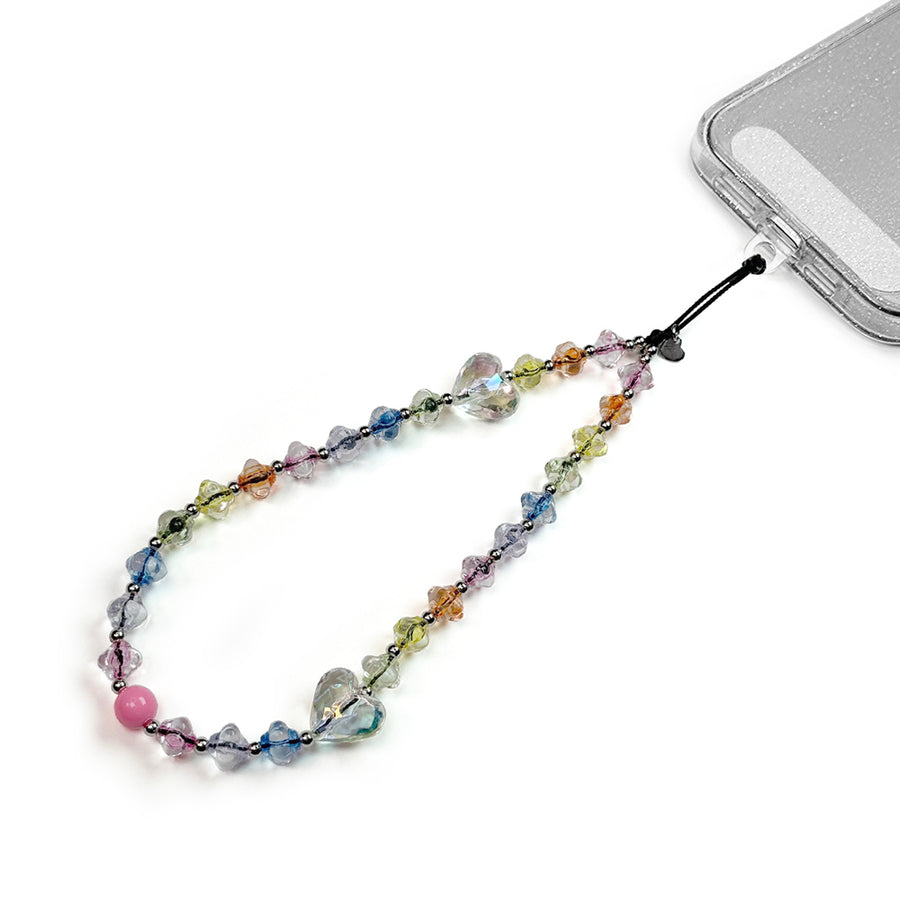 Dream Hatossa Phone charm attached to a phone with a universal lanyard holder. 