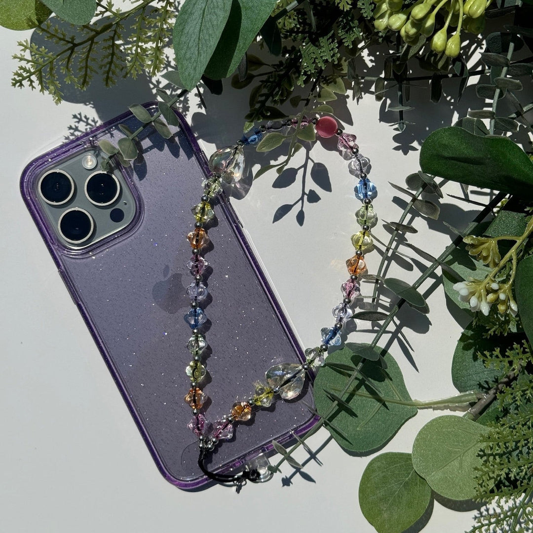 Image shows the Hatossa DREAM phone strap, phone charm, with the universal lanyard holder that can be used with any device, ebook, airpods.