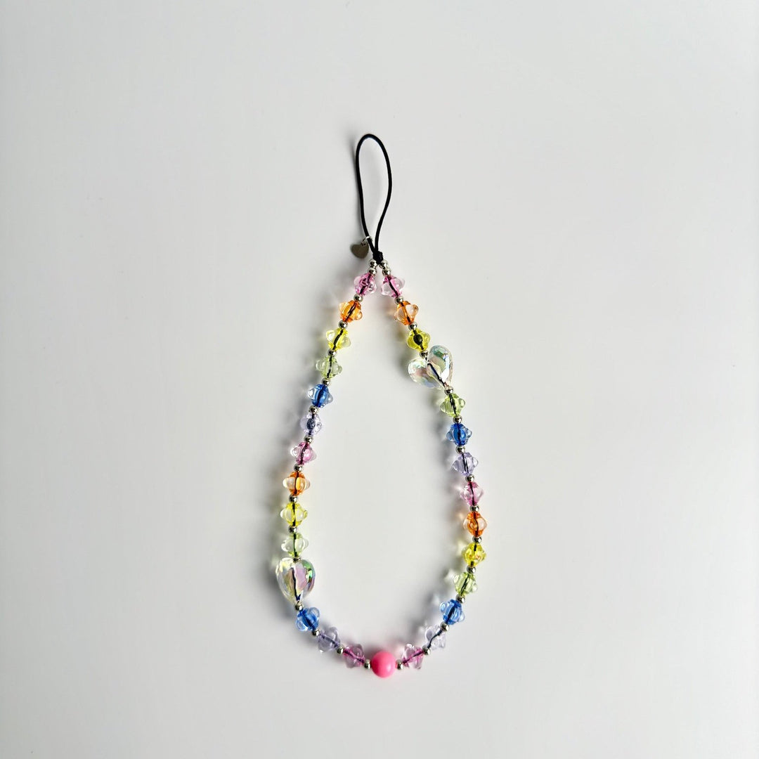 Image shows the Hatossa DREAM phone strap, phone charm, with the universal lanyard holder that can be used with any device, ebook, airpods