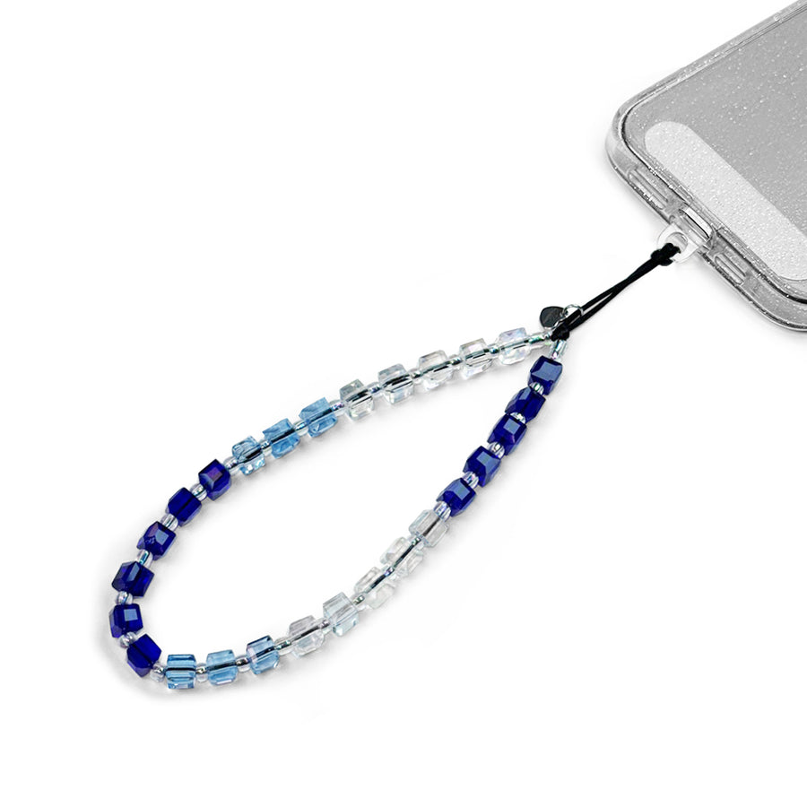 Mykonos Hatossa Phone charm attached to a phone with a universal lanyard holder. 