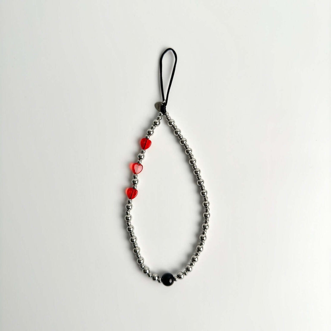 Image shows the Hatossa NOVA phone strap, phone charm, with the universal lanyard holder that can be used with any device, ebook, airpods