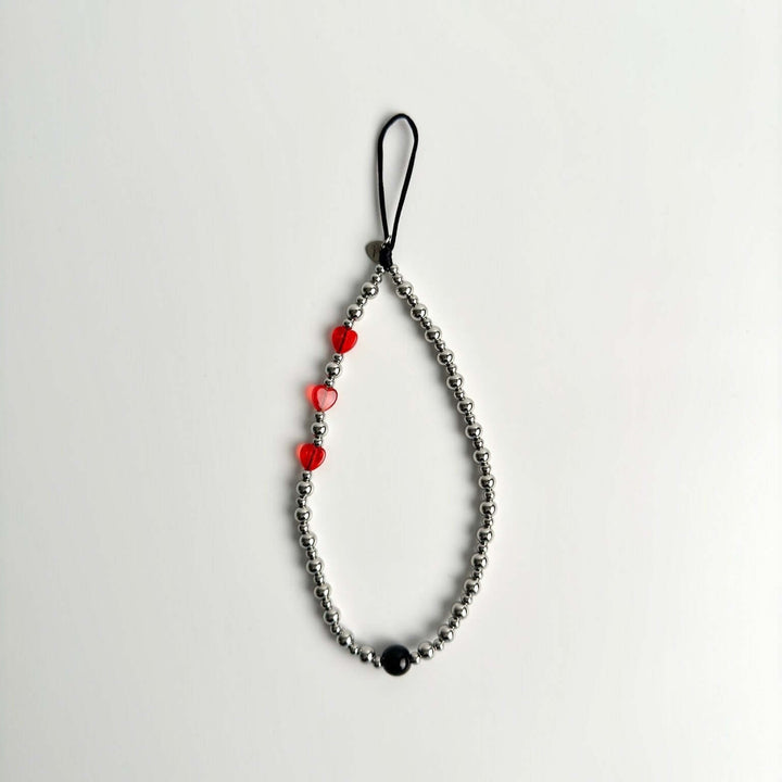 Image shows the Hatossa NOVA phone strap, phone charm, with the universal lanyard holder that can be used with any device, ebook, airpods