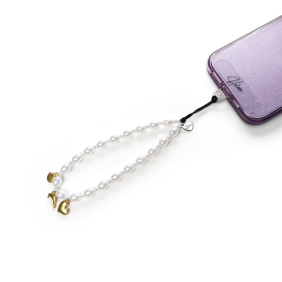 Ocean Hatossa Phone Charm attached to a phone with the universal lanyard holder.