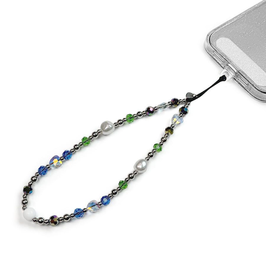 Royalty Hatossa Phone charm attached to a phone with a universal lanyard holder. 