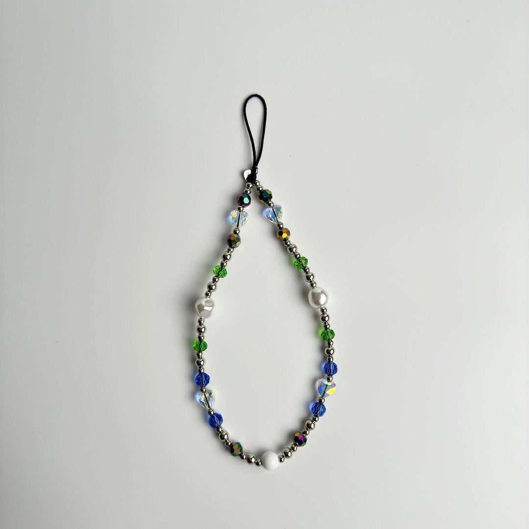 Image shows the Hatossa Royalty phone strap, phone charm, with the universal lanyard holder that can be used with any device, ebook, airpods