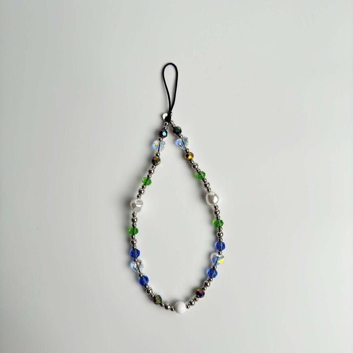 Image shows the Hatossa Royalty phone strap, phone charm, with the universal lanyard holder that can be used with any device, ebook, airpods