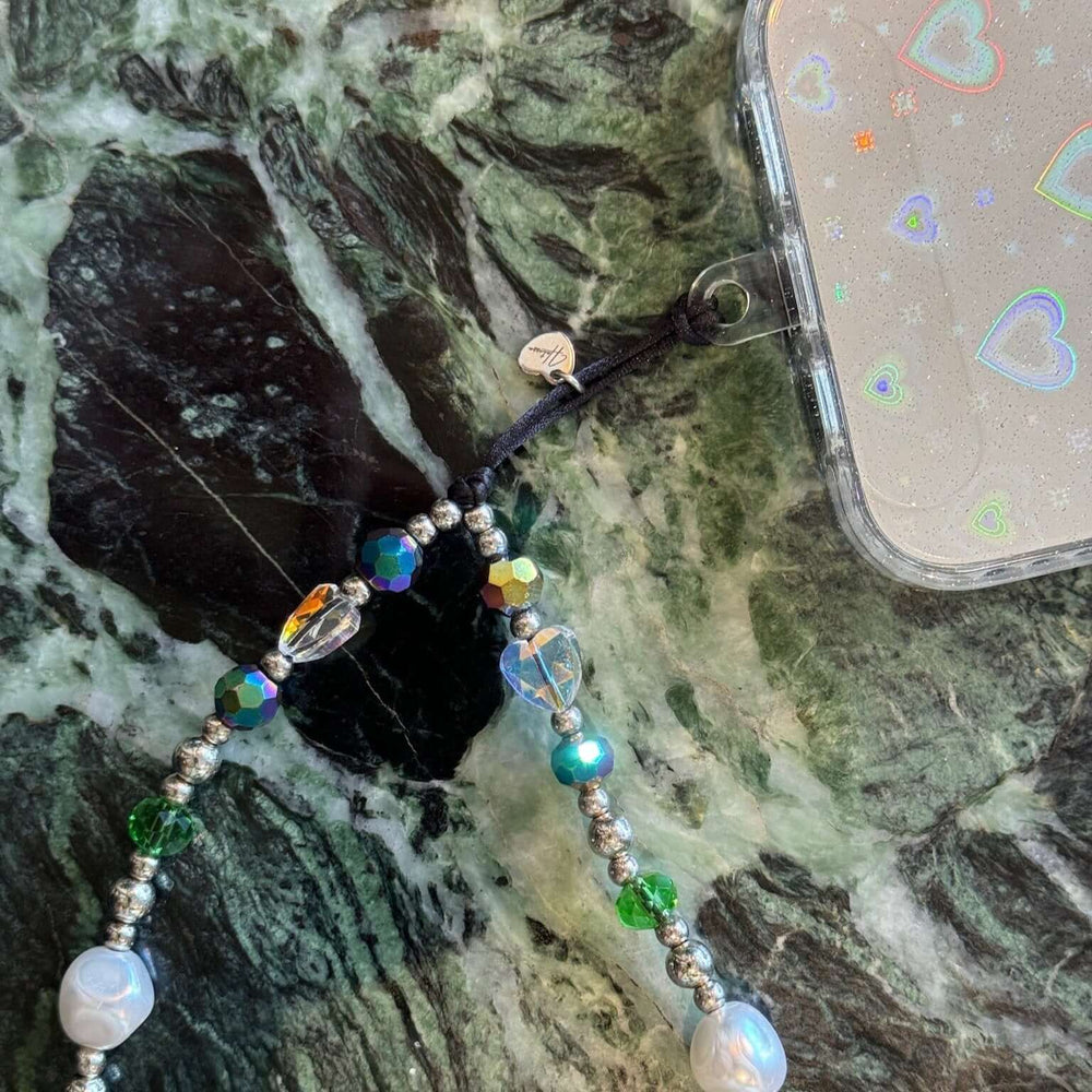 Image shows the Hatossa Royalty phone strap, phone charm, with the universal lanyard holder that can be used with any device, ebook, airpods