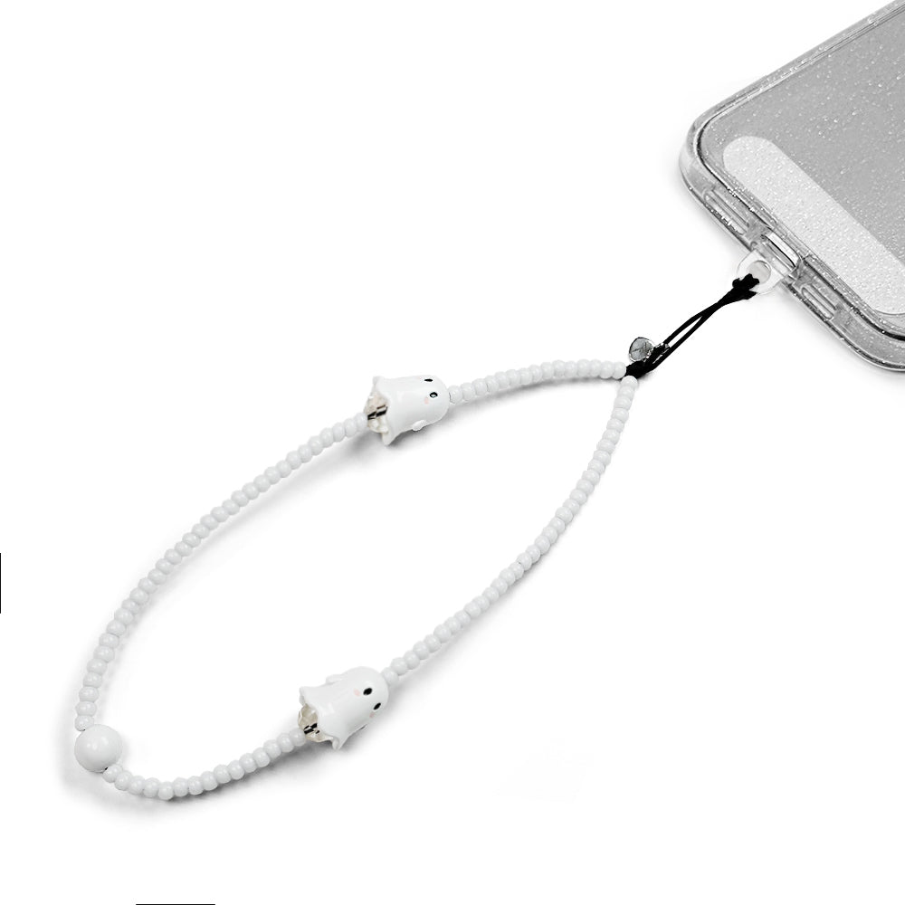 Spooky Hatossa Phone charm attached to a phone with a universal lanyard holder. 