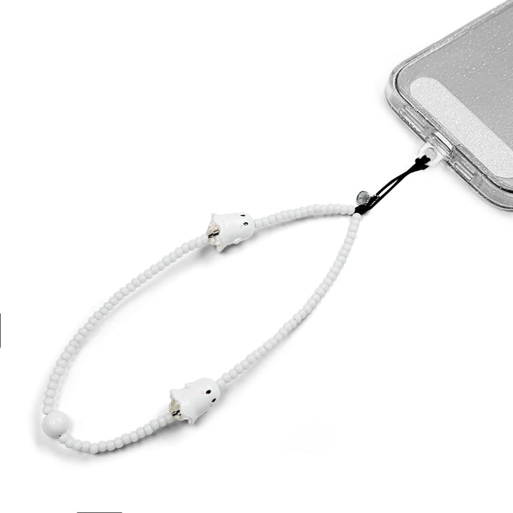 Spooky Hatossa Phone charm attached to a phone with a universal lanyard holder. 