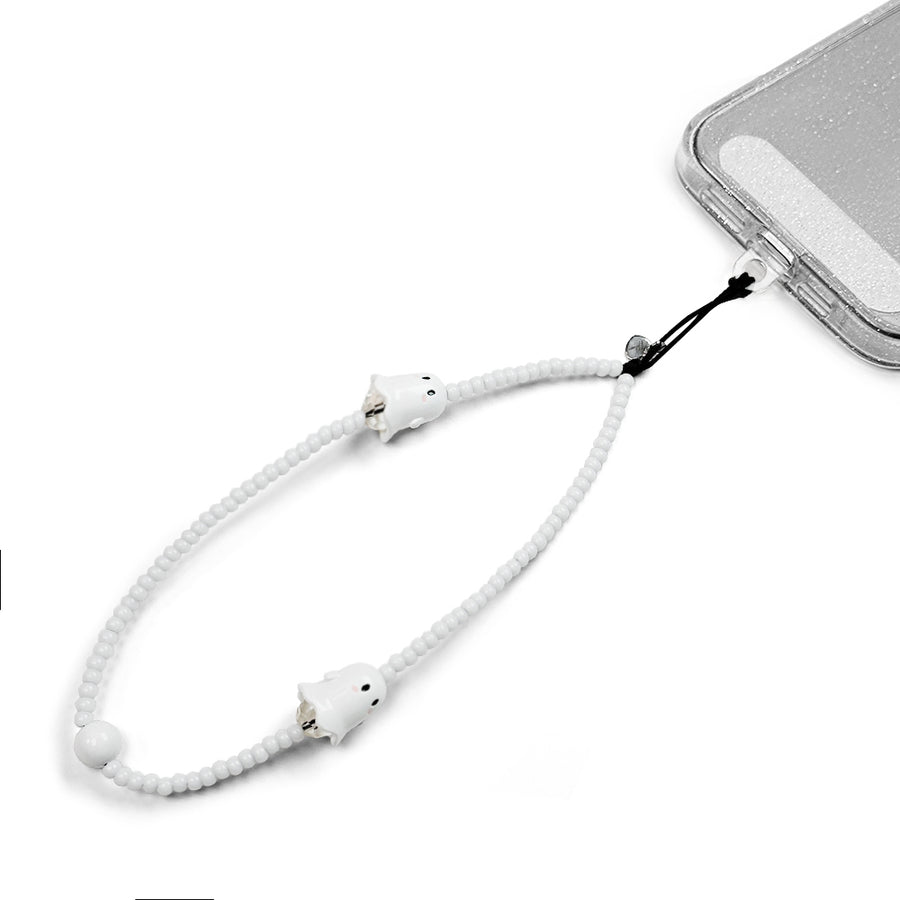 Spooky Hatossa Phone charm attached to a phone with a universal lanyard holder. 