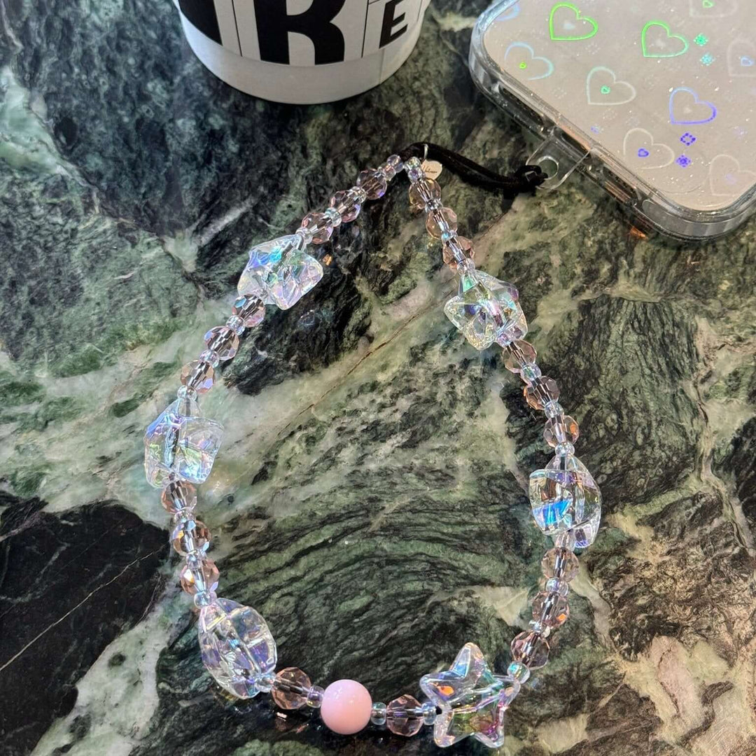 Image shows the Hatossa STARLIGHT phone strap, phone charm, with the universal lanyard holder that can be used with any device, ebook, airpods