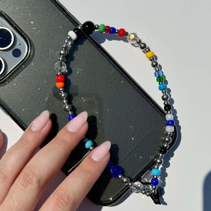 Image shows the Hatossa STELLA phone strap, phone charm, with the universal lanyard holder that can be used with any device, ebook, airpods