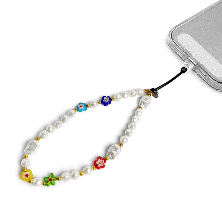 Summer Hatossa Phone charm attached to a phone with a universal lanyard holder. 