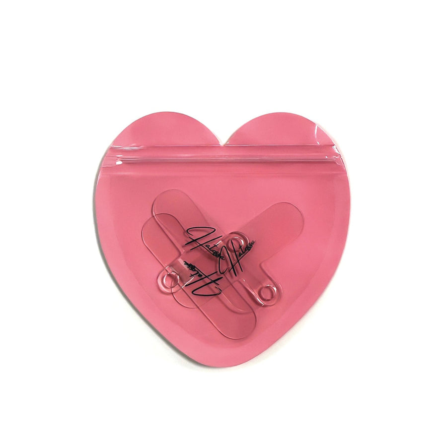 A pack of 3 Hatossa universal lanyard holders that are inside a heart shaped PVC bag.